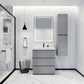 Modern bathroom vanity with a white marble top, black drawers, and a chrome faucet, set against a backdrop of a modern bathroom with a side cabinet.