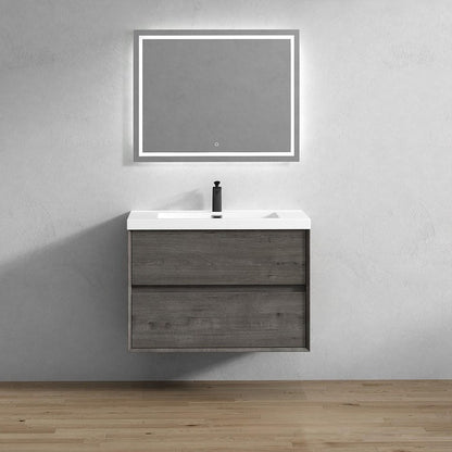 Wall-mounted bathroom vanity with a rectangular mirror and a single sink, finished in a light wood color, mounted on a white wall in a modern bathroom setting.