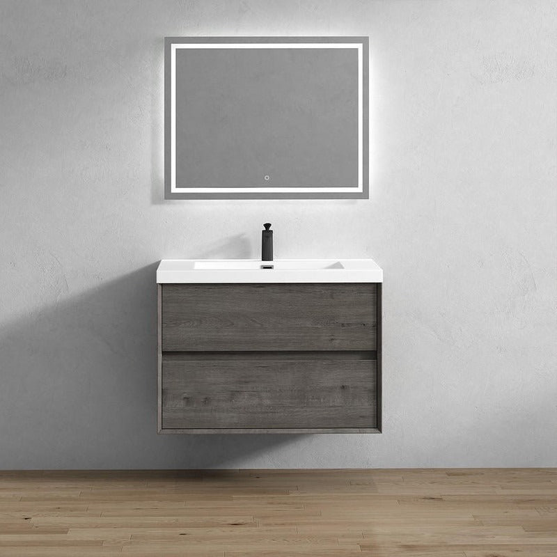 Wall-mounted bathroom vanity with a rectangular mirror and a single sink, finished in a light wood color, mounted on a white wall in a modern bathroom setting.